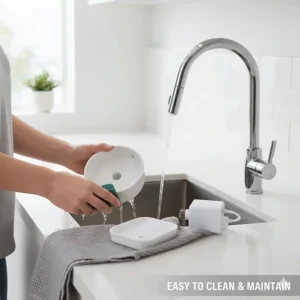 A person cleaning a disassembled dishwasher-safe cat water fountain in a kitchen sink.