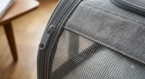 Close-up detail of the durable fabric and mesh ventilation panels on the carrier.