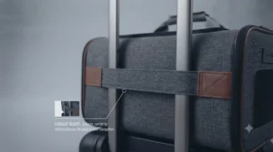 A pet carrier featuring a luggage sleeve to secure it to a rolling suitcase for easy airport navigation.